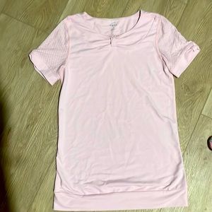 Light pink athletic shirt made from spandex material. Barely worn.